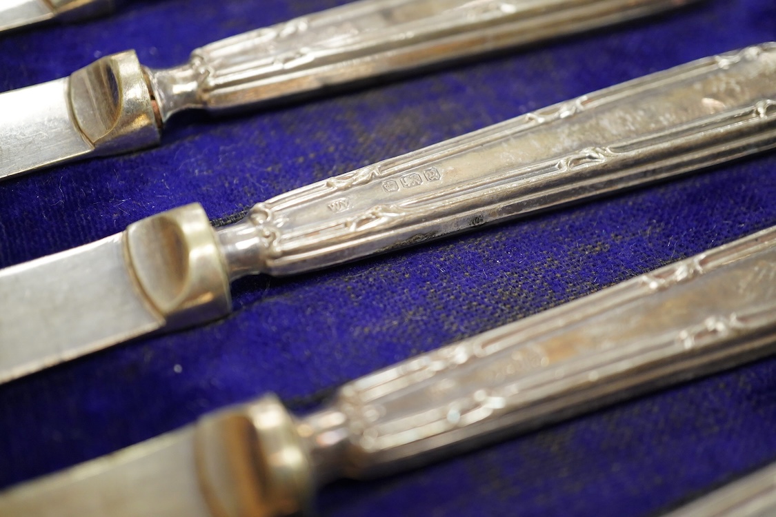 A George V engine turned silver and green enamel cigarette case, by Mappin & Webb, Birmingham, 1932, 82mm and a cased set of six silver handled tea knives.